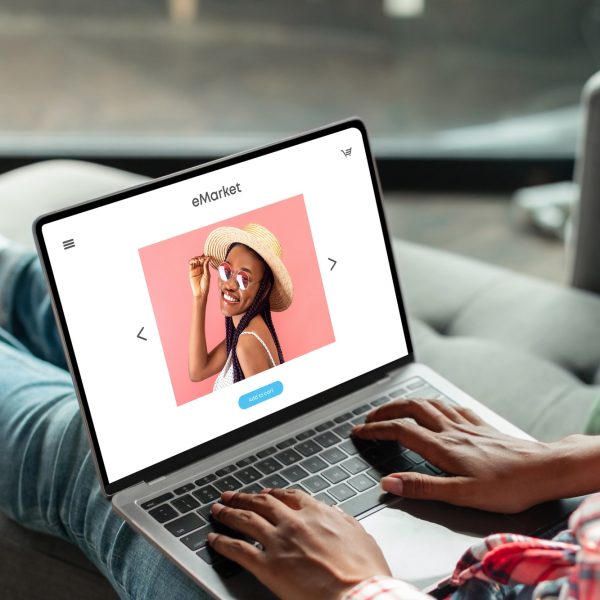 Black woman shopaholic enjoy online shopping, ordering new clothes at store on laptop screen