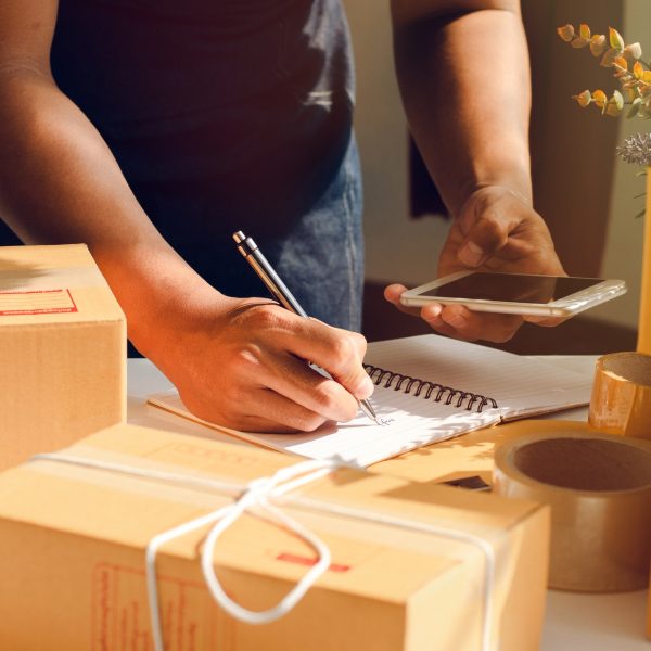 The owner of an online store is counting parcels to be sent to customers.
